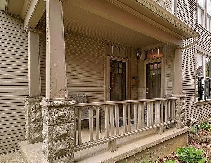 An early 20th century American home with two front doors.
